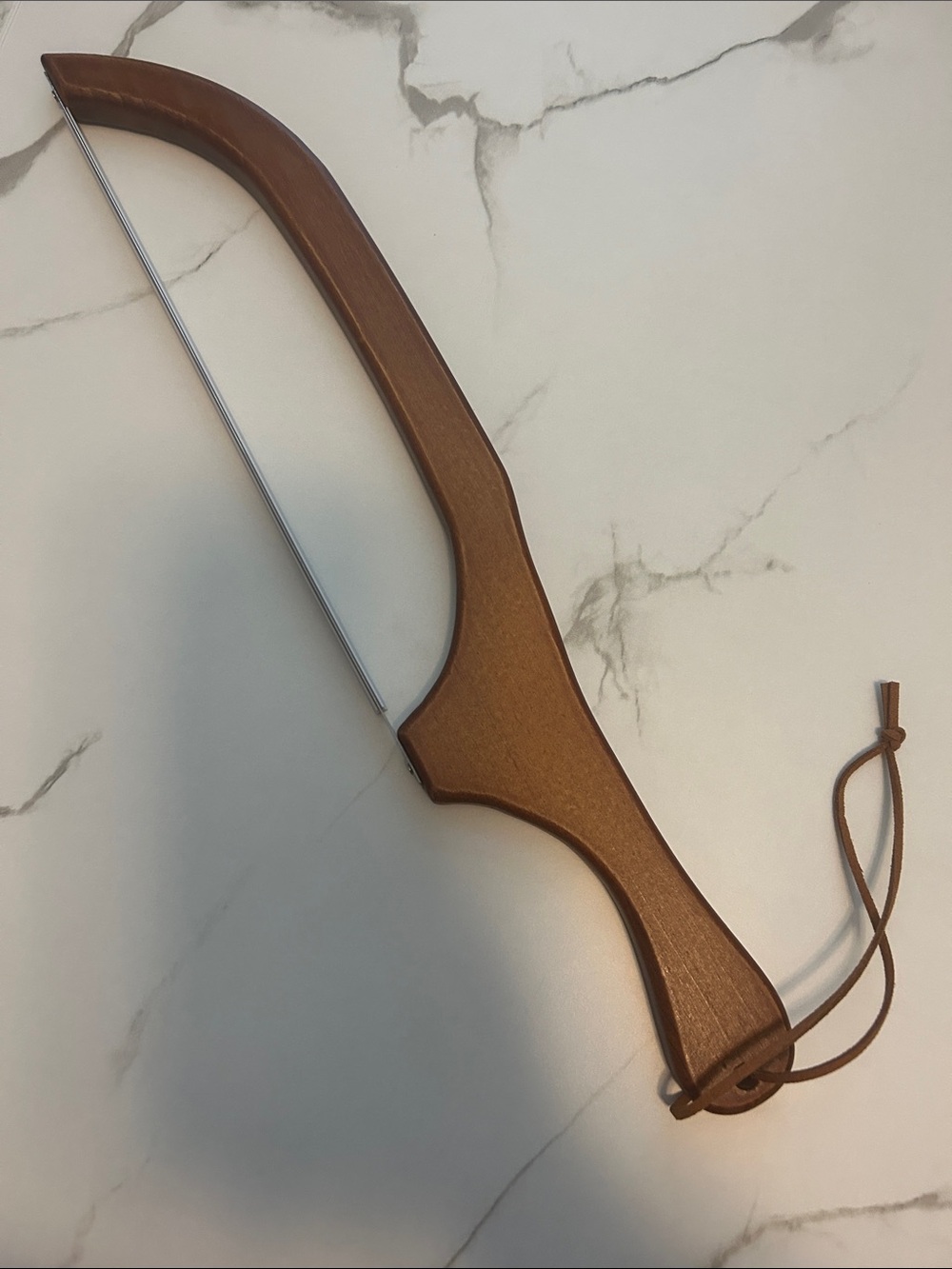 Brown Wooden Bow-Style Bread Cutter with Leather Loop